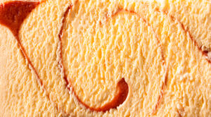 close up of layered formulated ingredients making a delicious creamy caramel flavor ice cream with caramel swirls 
