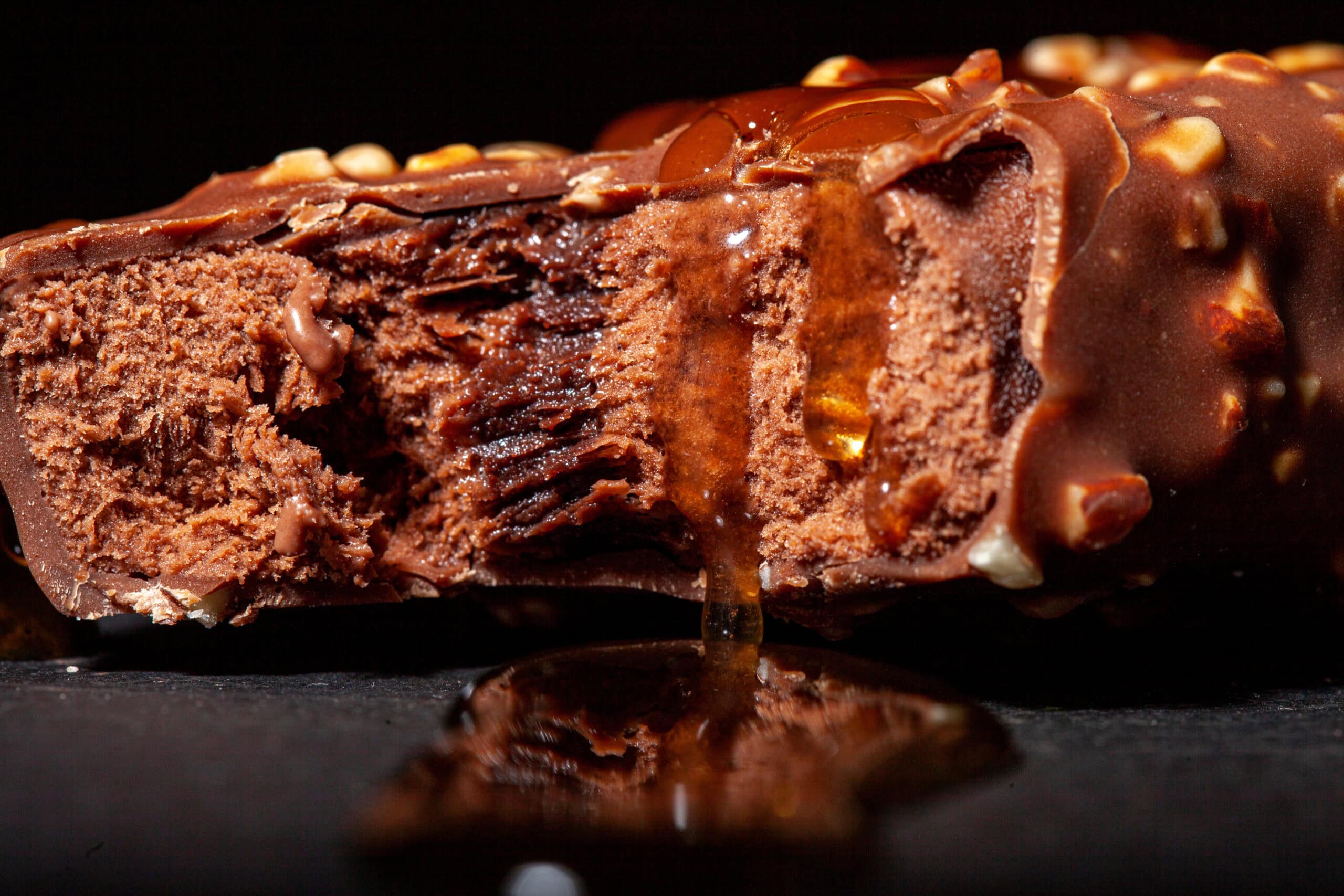 Premium ice cream bar with caramel coating demonstrating indulgent format design
