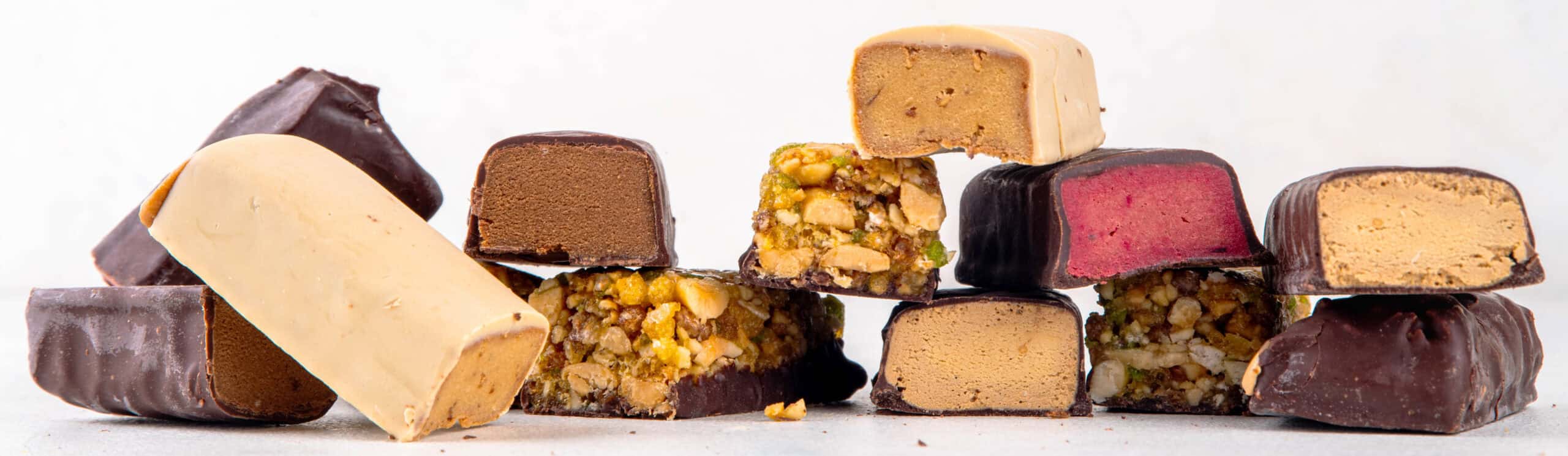Premium chocolate bars with varied fillings showcasing modern bakery trends in functional, nutrient-dense bar formulations
