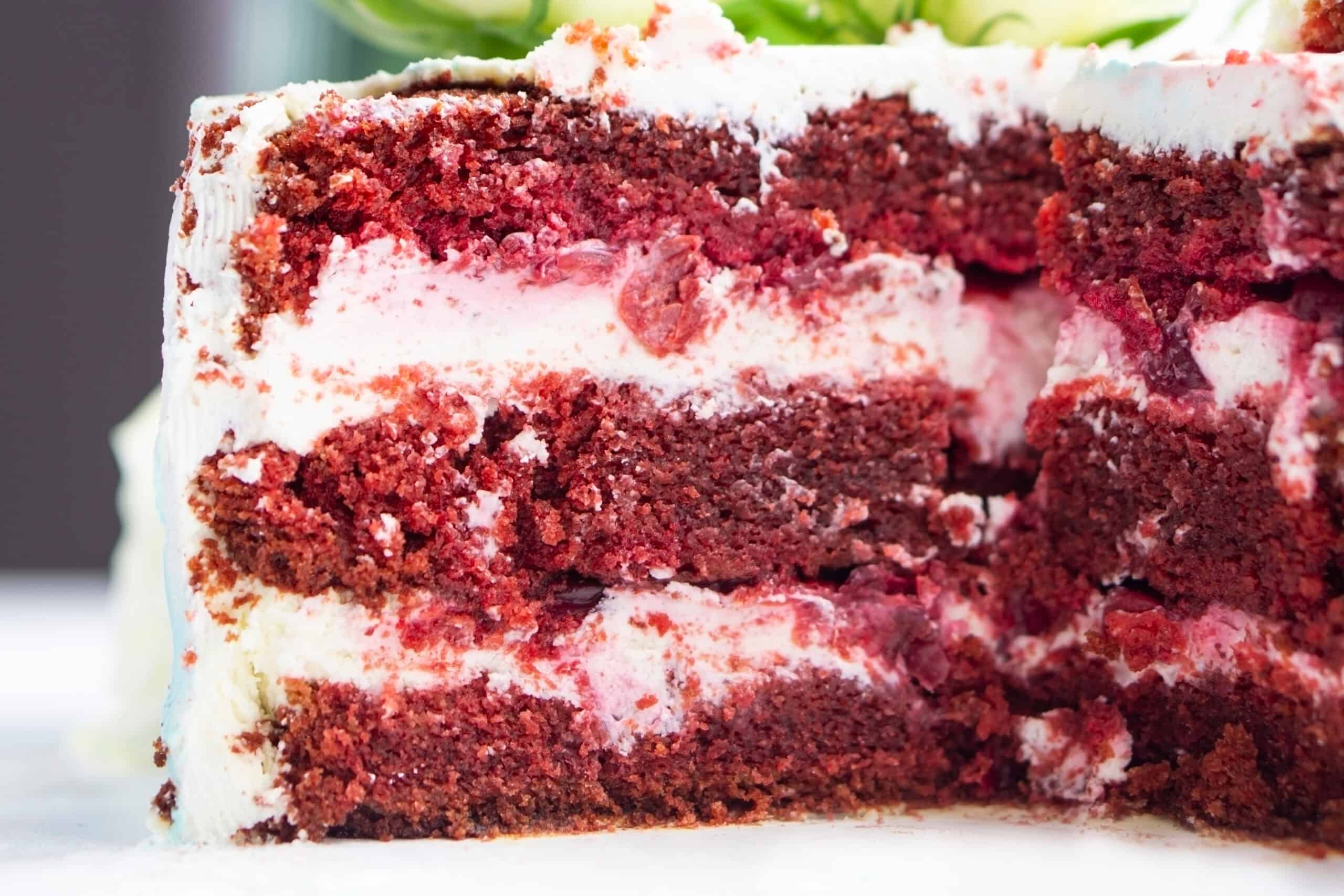 Multi-layer red velvet cake with vibrant natural coloring representing current bakery trends toward cleaner labels and natural colors