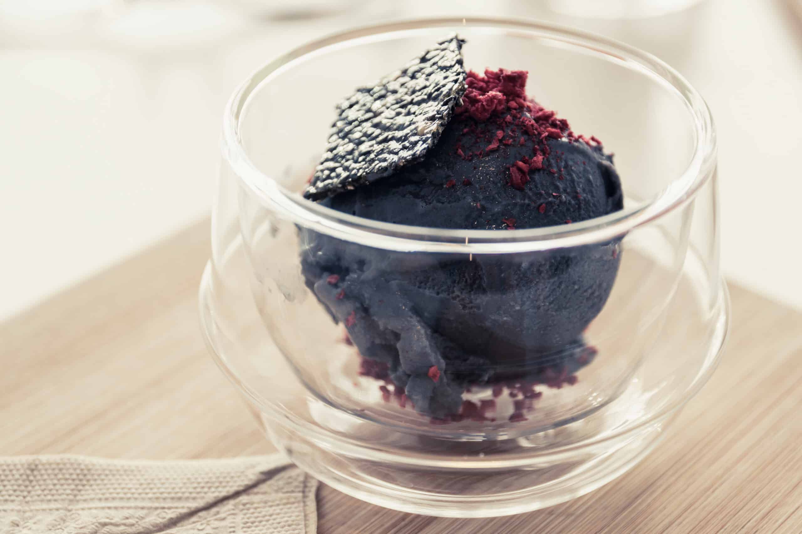 Creamy tofu-based ice cream with black sesame seeds and garnish, superfood, plant-based