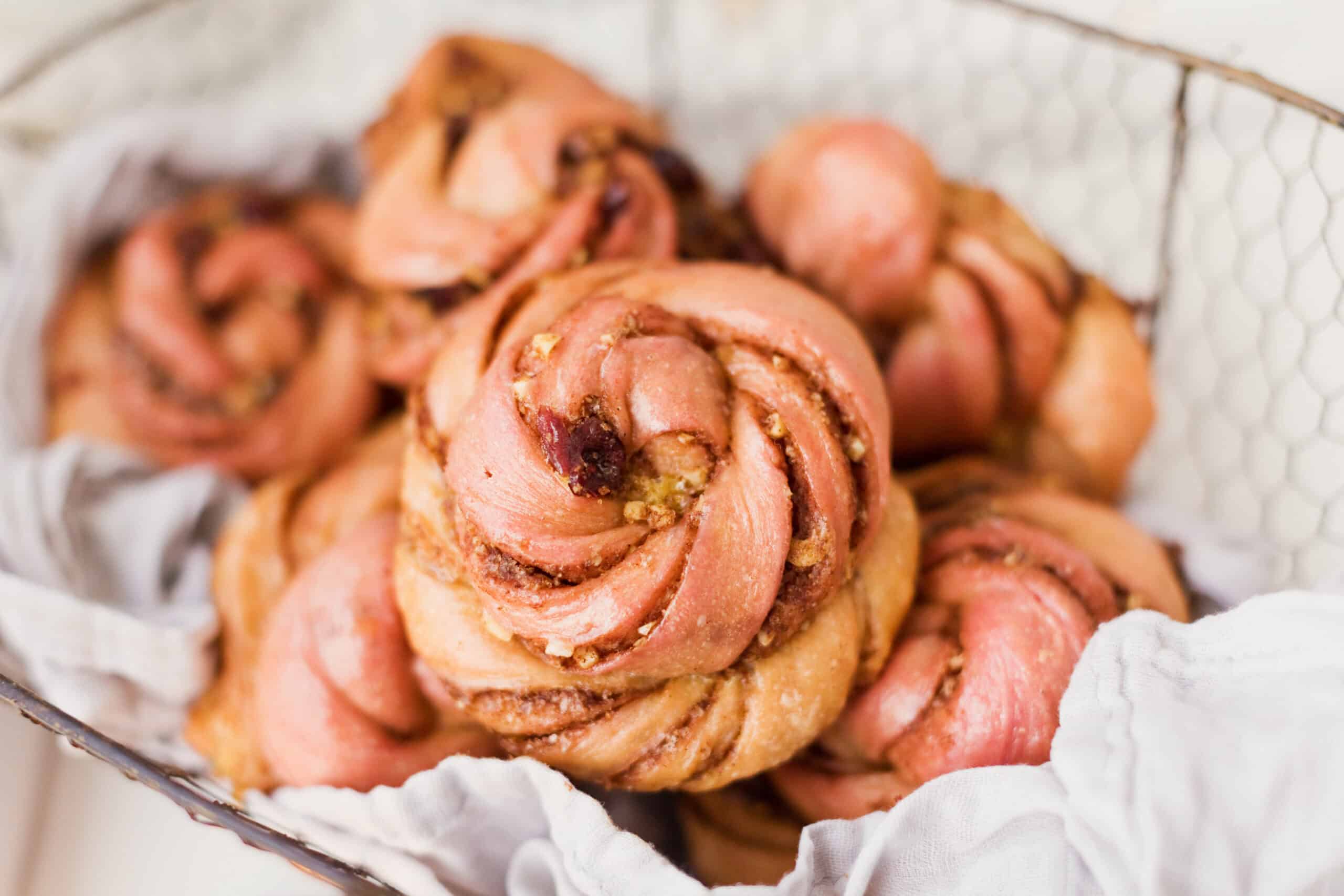 Traditional Swedish cardamom sweet buns in vintage metal basket