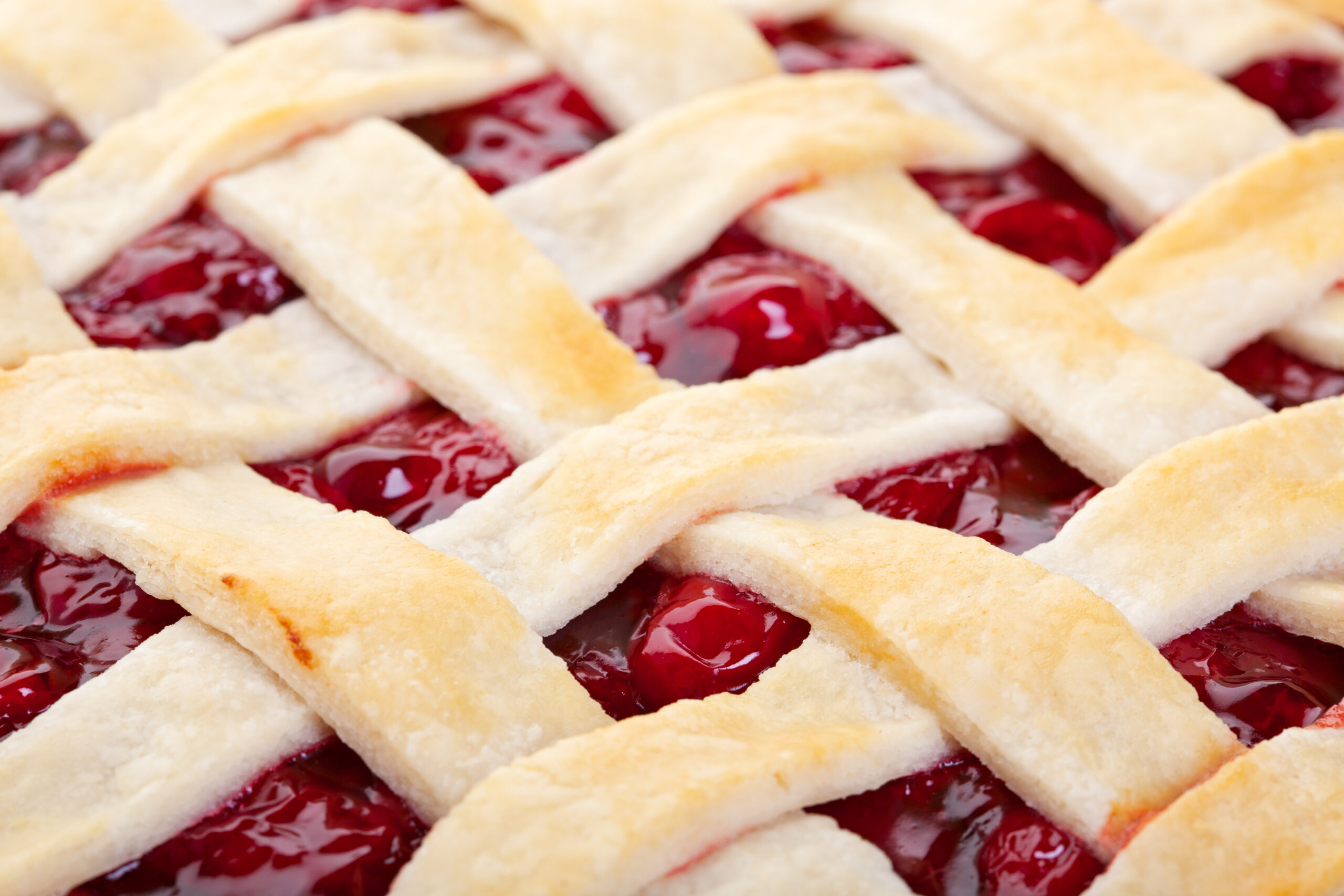 Fresh cherry pie with lattice crust, perfect for baking and desserts.