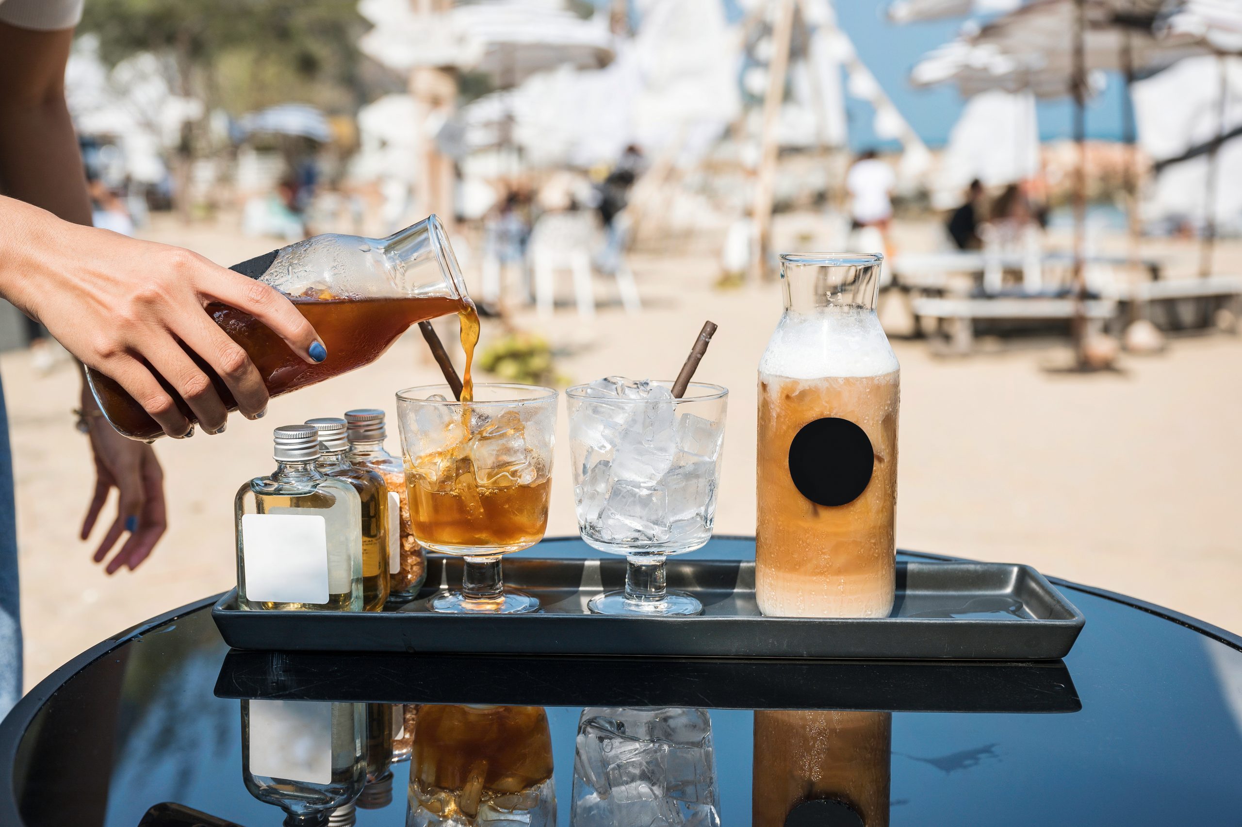 Cold brew poured over ice at an outdoor cart, reflecting food service beverage trends