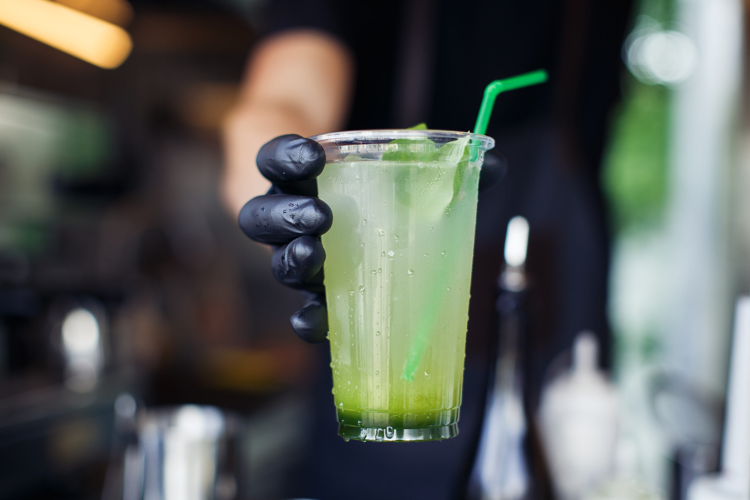 Fresh limeade handed over in a clear cup, a staple of current food service beverage trends